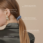 Woman with a hair tie on her ponytail against a beige background, with text highlighting features of the hair tie.